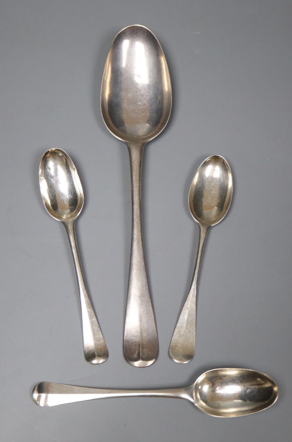 An 18th century Jersey silver table spoons, makers mark for Pierre Amiraux, 19.5cm and three 18th century shell back teaspoons